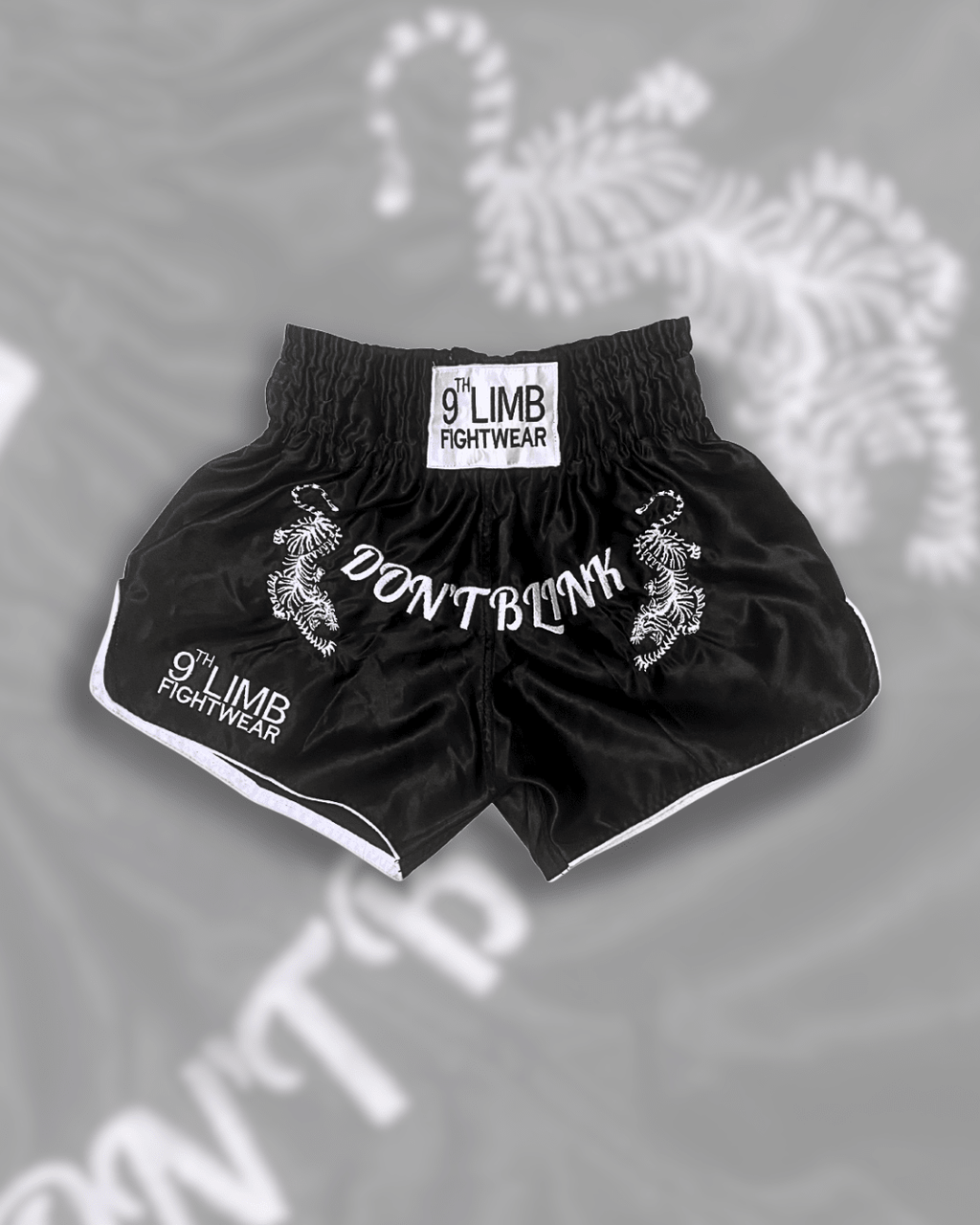Black 9th Limb “Don’t Blink” Muay Thai Shorts – Black Satin Fightwear - 9thLimbHQ