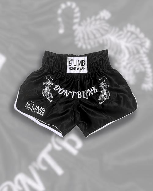 Black 9th Limb “Don’t Blink” Muay Thai Shorts – Black Satin Fightwear - 9thLimbHQ